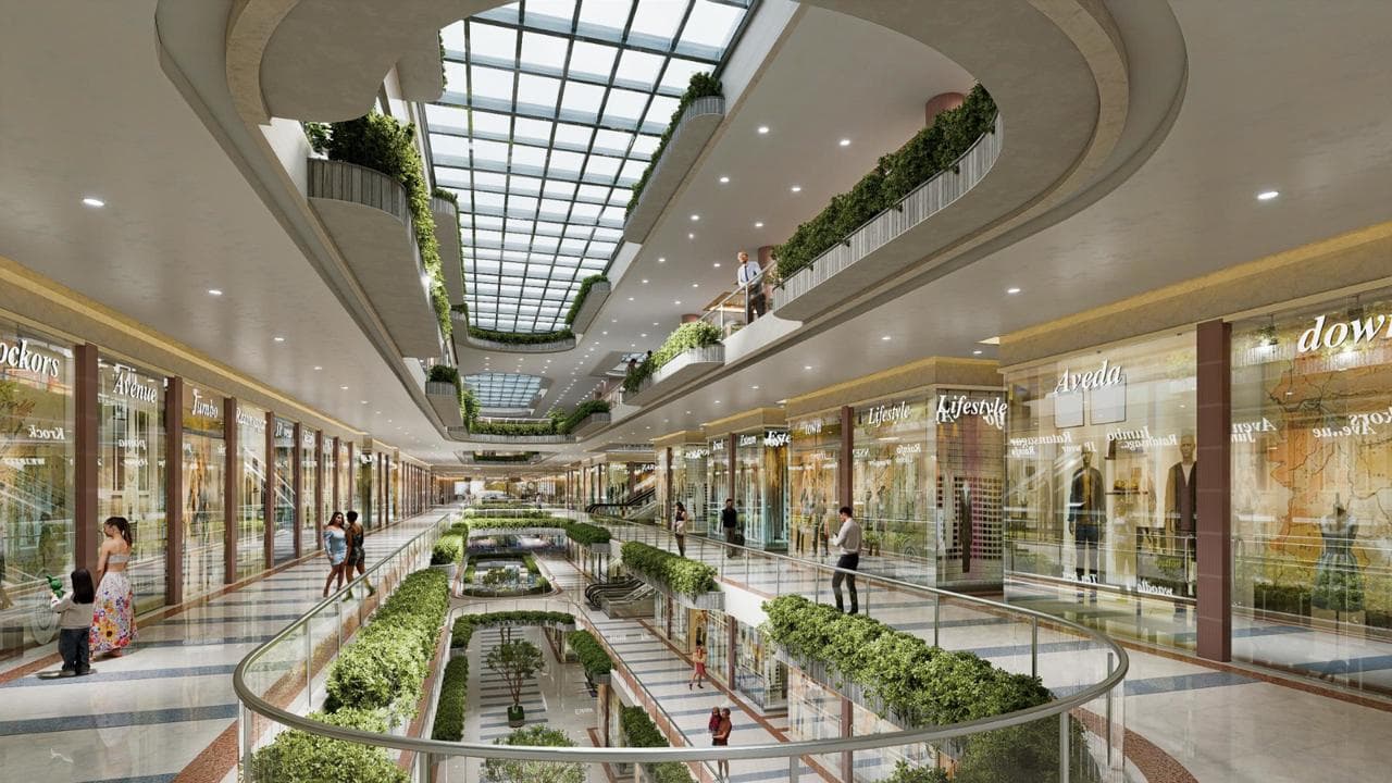 The Hive Mall Hapur interior — multi-level shopping atrium with skylight and premium retail brands